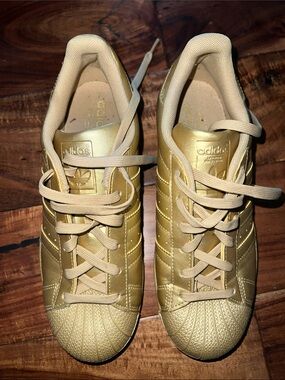 adidas Women’s Metallic Gold Superstar Sneakers